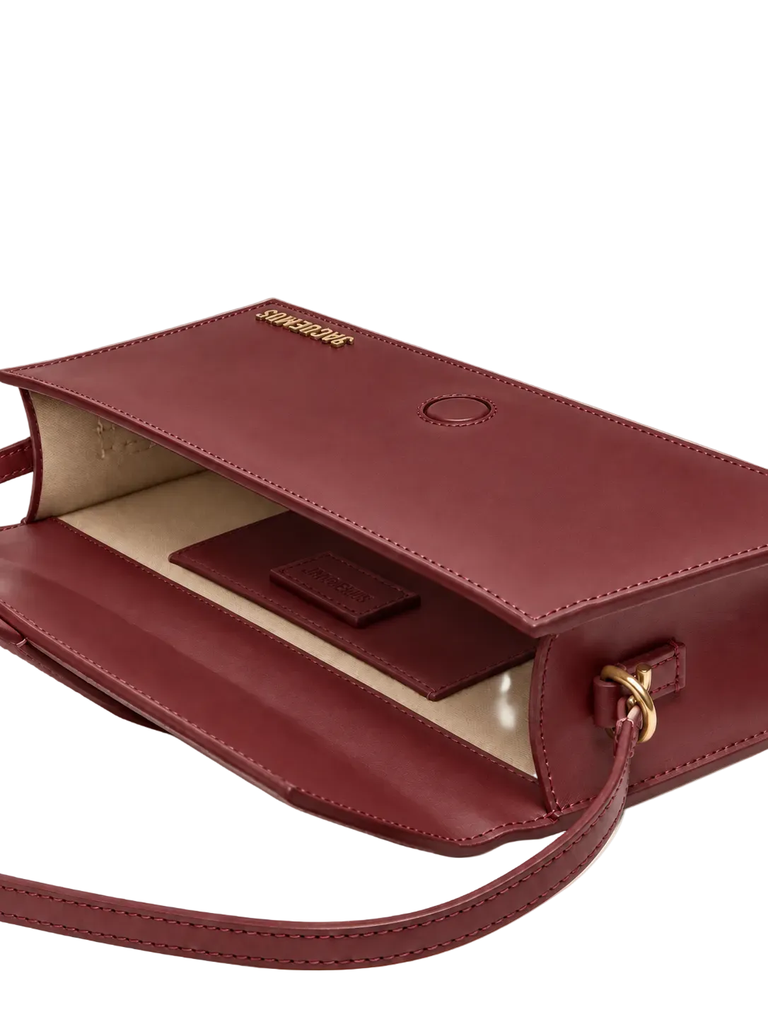 Jacquemus Le Bambino Lungo rosso con hardware oro aperta con interno visibile